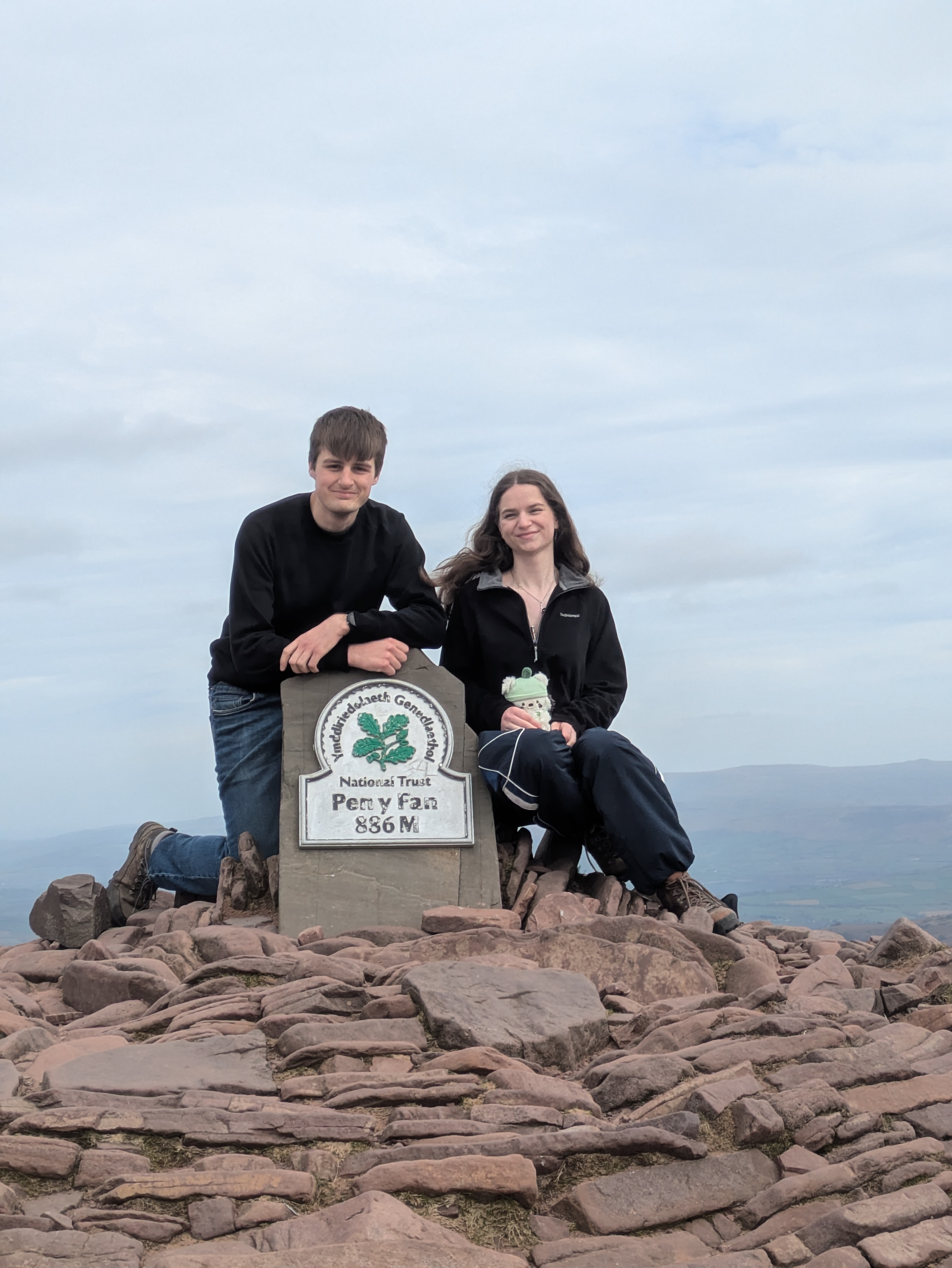 A photo of Leo, Grace and Pom at the top of Pen y Fan