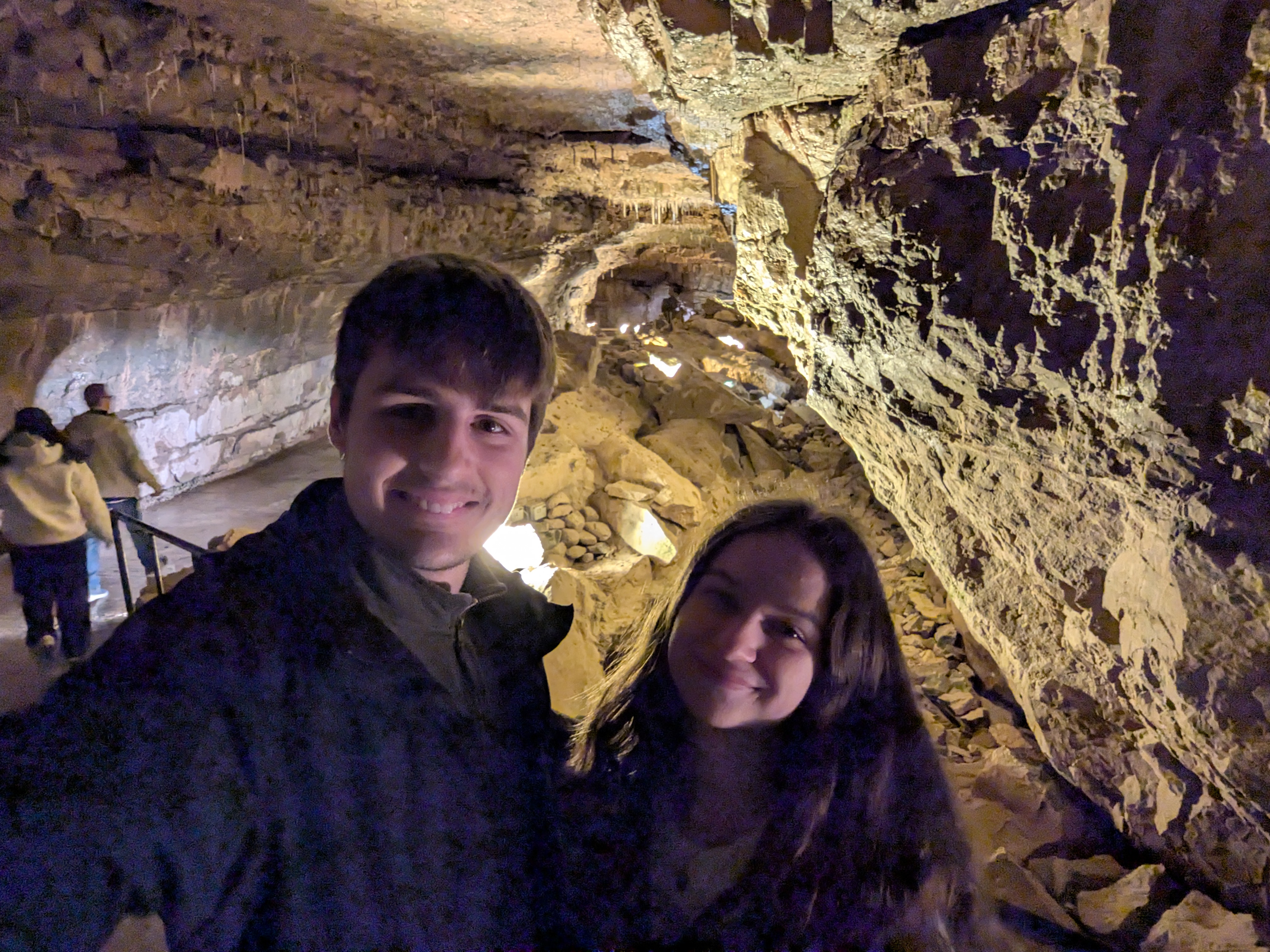 A photo of Leo and Grace in a cave with a manmade walkway